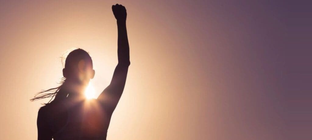 A person raising their fist in the air.