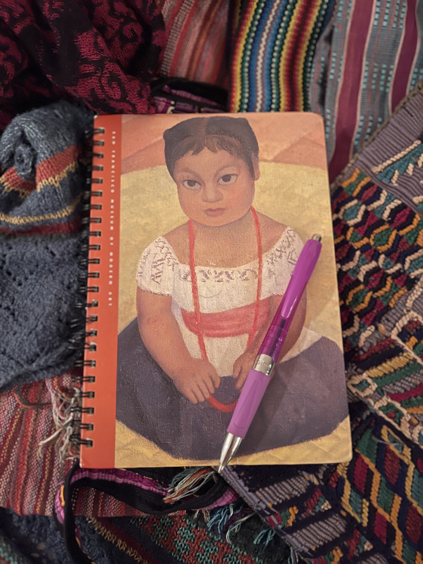 A notebook with a picture of a girl on it.