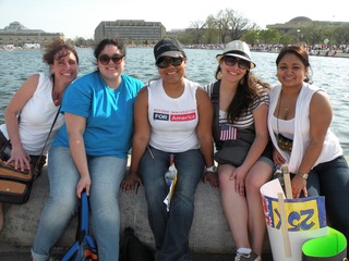 A group of women sitting on the back of a boat.