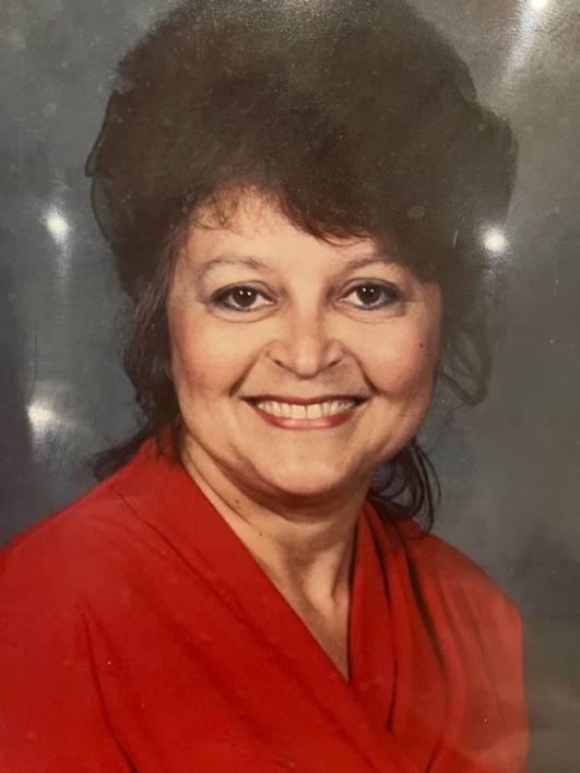 An image of a woman wearing a red blouse