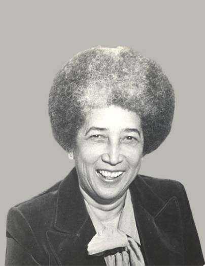 A black and white photo of an older woman.